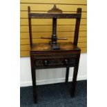 A NINETEENTH CENTURY OAK PRESS TABLE with carved single door to the front bearing turned knobs,