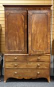 A VICTORIAN MAHOGANY PRESS-CUPBOARD having a chest base of two long and two short drawers below a