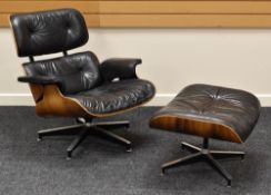 A MID TO LATE TWENTIETH CENTURY CHARLES AND RAY EAMES BUTTONED BLACK LEATHER CHAIR matching ottoma