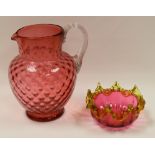TWO ITEMS OF CRANBERRY GLASS being a large jug with clear glass handle and a bowl with a vaseline