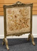 ROCCOCO-STYLE CARVED GILT FRAME FIRESCREEN with silk embroidered flowers, 105 x 72 cms