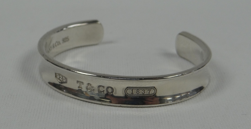 A MODERN BOXED TIFFANY SILVER OPEN-BANGLE engraved 'T&Co 1837' and 925, 1.31ozs