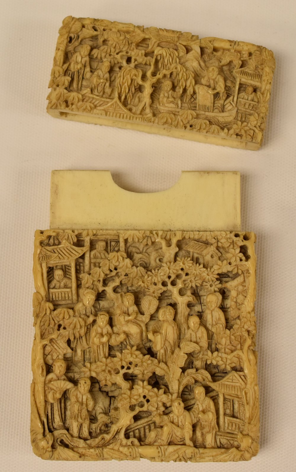 A CHINESE CARVED CARD-CASE having a pull lid and intricately carved all-round with figures and - Image 2 of 2