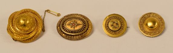 FOUR 'TARGET- STYLE' PHOTO-LOCKET BROOCHES, each in unmarked yellow metal