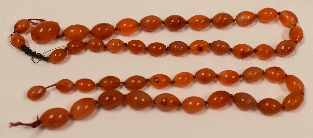 TWO STRANDS OF GRADUATED AMBER BEADS, 132gms