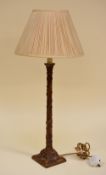 A VINTAGE FAUX-WOOD TABLE LAMP & SHADE