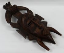 AN AFRICAN TRIBAL MASK with primitive carved decoration, 48cms high BBC Bargain Hunt