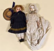 A LATE VICTORIAN BISQUE HEAD DOLL in sailor's costume, unmarked, 48cms long; together with another