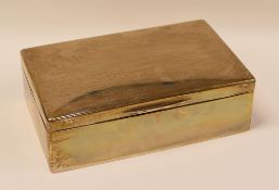 A LARGE SILVER CIGARETTE BOX OF PLAIN FORM WITH HINGED LID and having a wooden interior, London