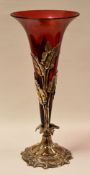 AN EPNS & CRANBERRY GLASS EPERGNE, with single trumpet with scroll-work and leaf socket and base,