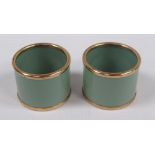 A PAIR OF BOXED VINTAGE 'BILSTON ENAMEL ON COPPER' NAPKIN RINGS in green enamel and of plain-form