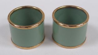 A PAIR OF BOXED VINTAGE 'BILSTON ENAMEL ON COPPER' NAPKIN RINGS in green enamel and of plain-form