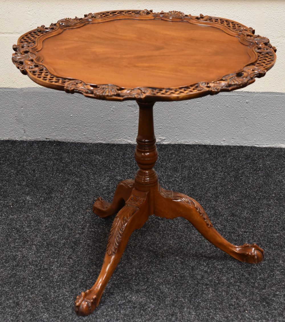 ORNATELY CARVED AND PIERCE REPRODUCTION TILTING TABLE with centre column tripod ball and claw