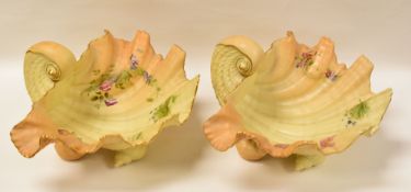 PAIR OF WORCESTER BLUSH IVORY SHELL-DISHES raised on shell-form feet and floral painted interiors (