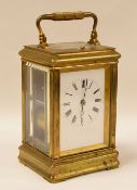 EARLY TWENTIETH CENTURY BRASS CASED ANGLO-FRENCH CARRIAGE CLOCK with eight day repeating movement