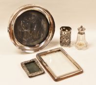 MIXED SMALL SILVER ITEMS including three photo-frames, a sauce-boat, bottle-holder etc