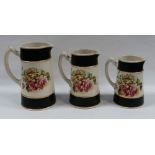 A GRADUATED TRIO OF STAFFORDSHIRE POTTERY JUGS COMMEMORATING THE ALLIED FORCES OF WORLD WAR I,