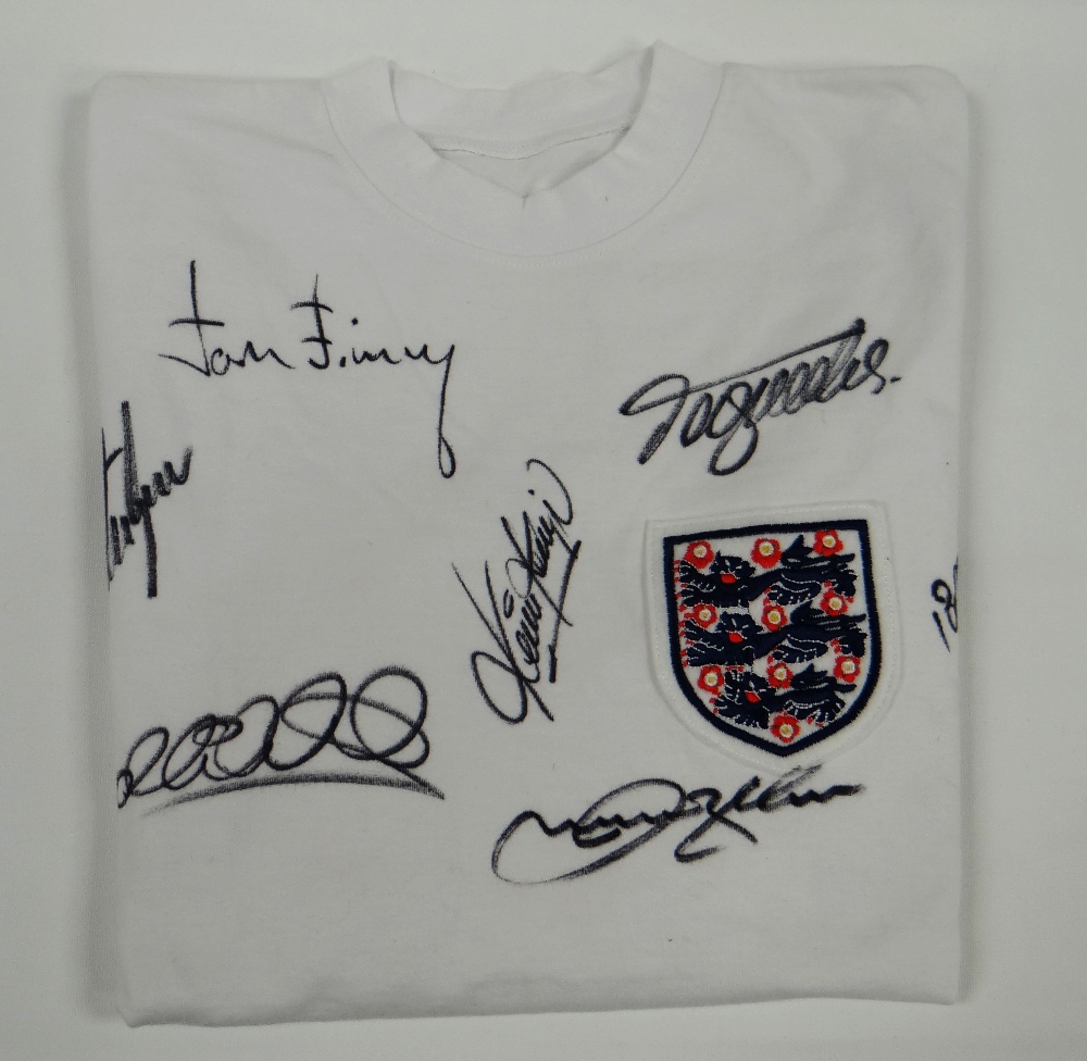 A WHITE ENGLAND CIRCA 1960s REPLICA SHIRT, signed by Tom Finney, David Beckham, Bobby Charlton,