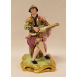 A RARE MINTON FIGURE OF A 'SPANISH' GUITAR PLAYER, model number 94 wearing richly decorated