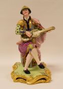 A RARE MINTON FIGURE OF A 'SPANISH' GUITAR PLAYER, model number 94 wearing richly decorated