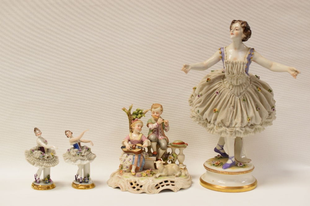 A GROUP OF CONTINENTAL PORCELAIN FIGURES comprising large lace-work porcelain ballet dancer, 30cms