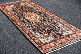 A BLUE GROUND AFGAN RUNNER in all over traditional design, 206 x 106 cms