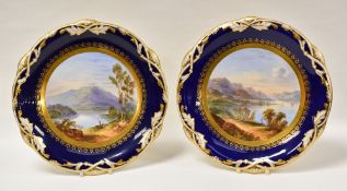 A PAIR OF DAVENPORT PORCELAIN DESERT PLATES with named Scottish landscape scenes painted by