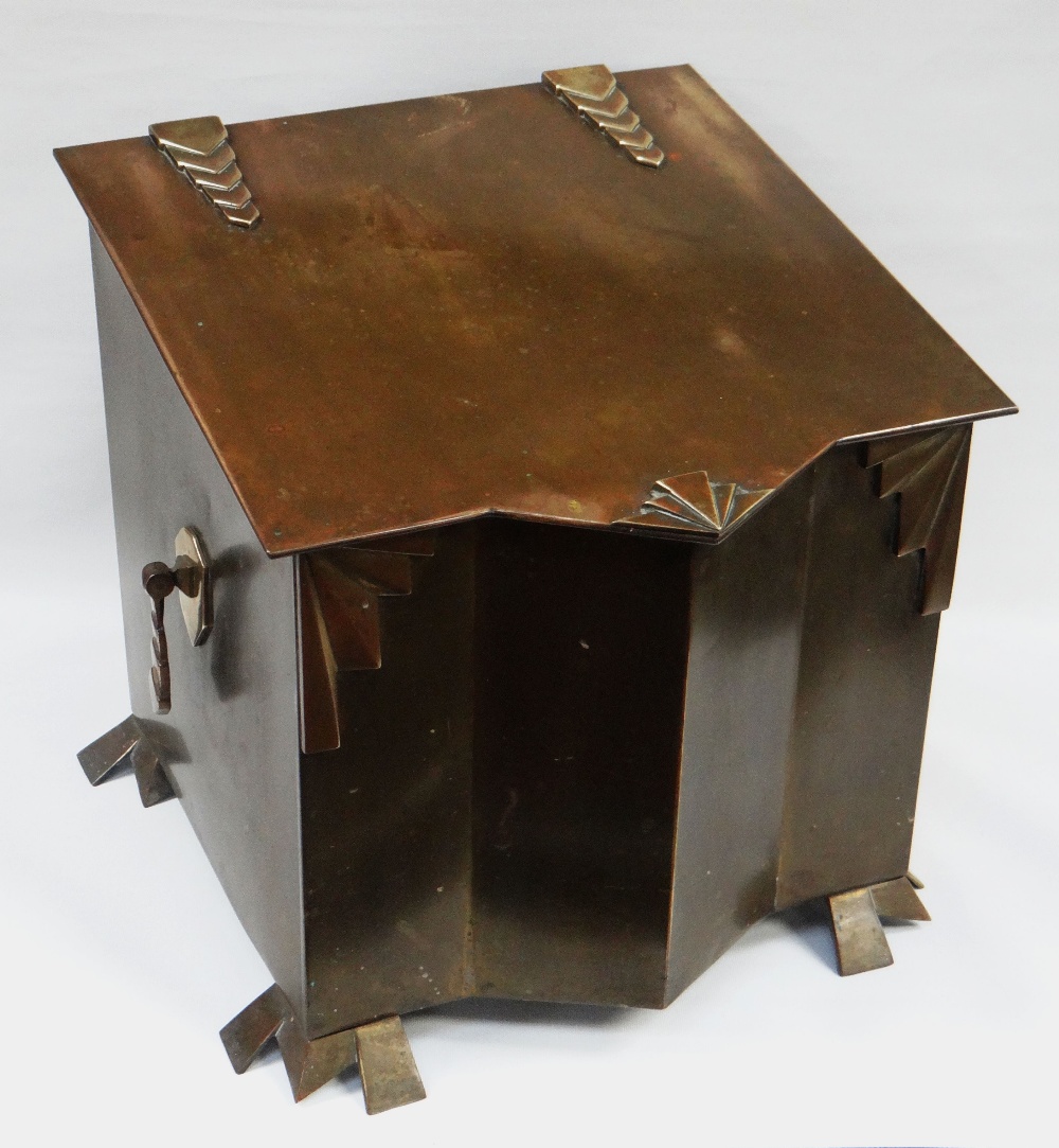 AN ART DECO BRASS PURDONIUM with hinged sloping lid and with typical geometric mounts for the