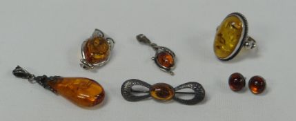 PARCEL OF FAUX-AMBER JEWELLERY comprising pendant, pair of earrings, owl-brooch, ring and bar-