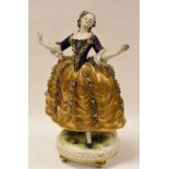 A GERMAN PORCELAIN FIGURE OF A LADY WITH FLORAL-ENCRUSTED DRESS on a raised circular base with