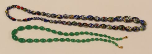 TWO STRANDS OF BEADS one in the colourful millefiore style, the other in faux-jade