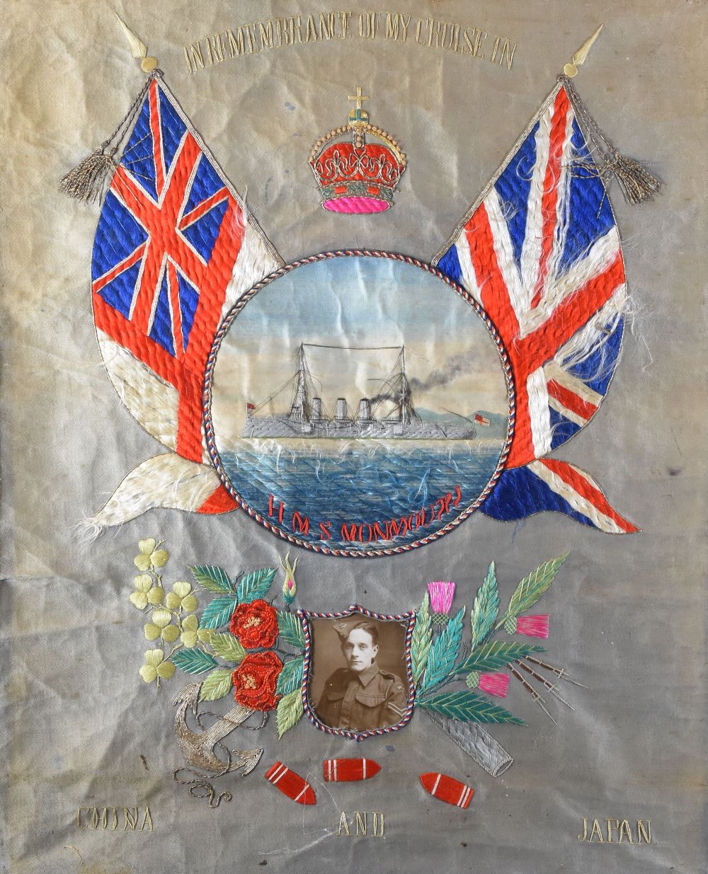 EARLY TWENTIETH CENTURY NEEDLEWORK PANEL COMMEMORATING HMS MONMOUTH, a 1901 built Royal Navy lead-