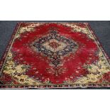 AN OLD PERSIAN TABRIZ RUG in traditional floral design, 270 x 185 cms