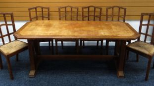 A BRYNMAWR OR STYLE DINING TABLE together with six rush-seated high-back dining chairs, 182 x 81 x