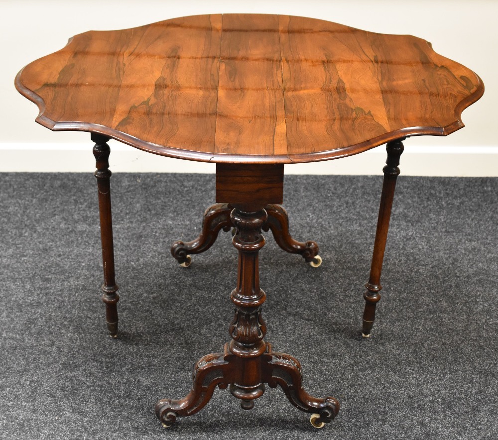 FINE QUALITY ROSEWOOD SUTHERLAND TEA TABLE with a shaped top and carved legs on original castors, 90 - Image 2 of 2