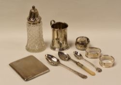 A PARCEL OF SILVER comprising machine-turned cigarette case, silver mug, spoons, napkin-rings and