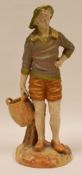 A ROYAL WORCESTER FIGURE OF A STANDING FISHERMAN on a rocky base, holding basket at hip, 21cms