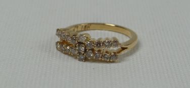 PRETTY 18ct 'OPEN BOW' RING set with nineteen good diamonds, 3.6gms