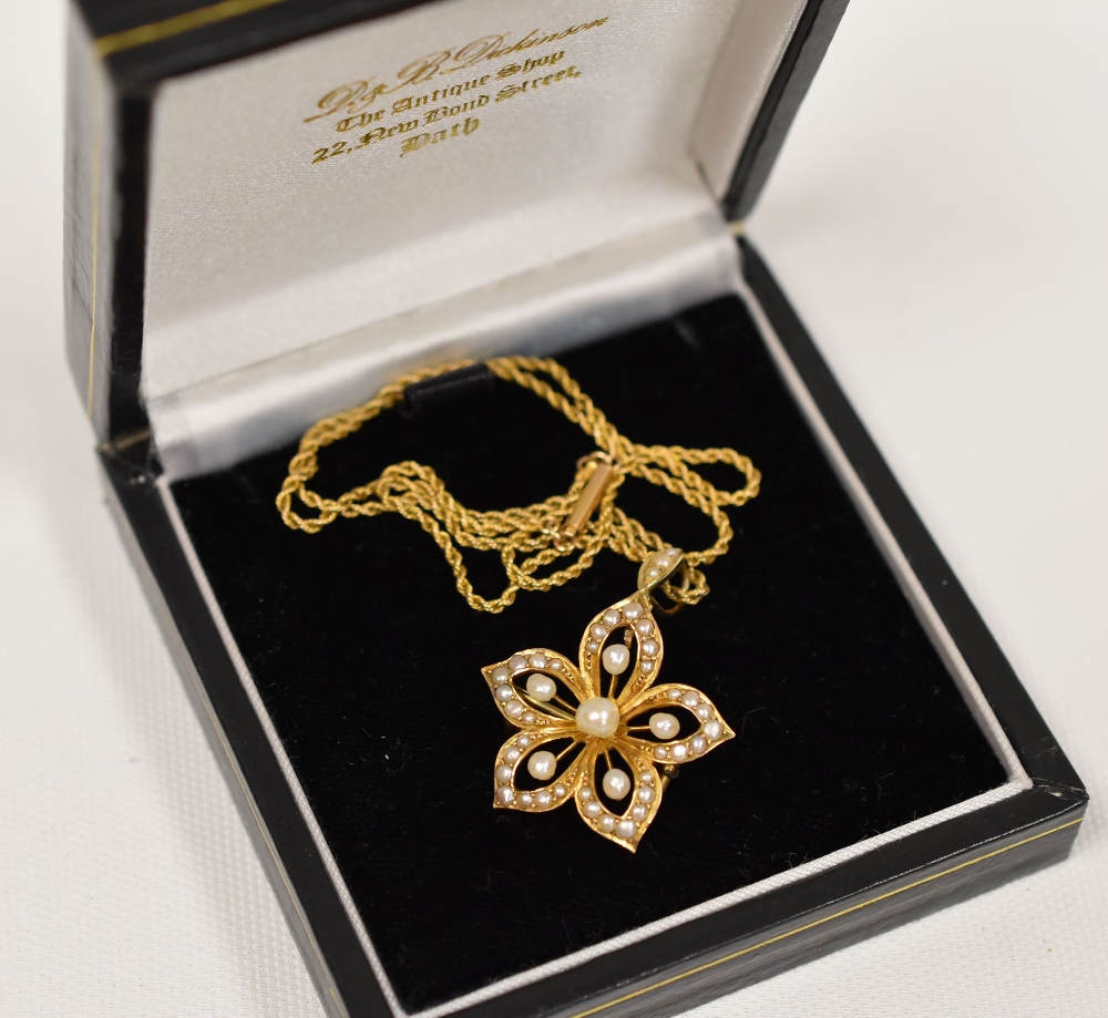 9CT YELLOW GOLD & SEED PEARL PENDANT of floral form and on a fine rope-chain necklace - Image 2 of 2