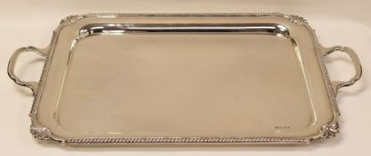 A SILVER TWIN-HANDLED TRAY with feathered border and shell corners, Sheffield 1939, 85ozs