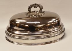AN 'OLD SHEFFIELD PLATE' FOOD COVER of oval form, with naturalistic handle, continuous gadrooning to