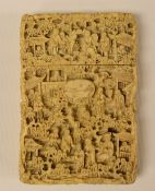 A CHINESE CARVED CARD-CASE having a pull lid and intricately carved all-round with figures and