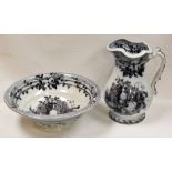 A NINETEENTH CENTURY STAFFORDSHIRE JUG AND BASIN monochrome decorated with garden scenes and with