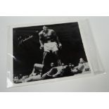 AN AUTOGRAPHED MUHAMMAD ALI BLACK AND WHITE BOXING PHOTOGRAPH