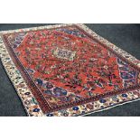 A PERSIAN SAROUK VILLAGE RUG in medallion design, 290 x 190 cms