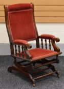 AMERICAN STYLE ROCKING CHAIR, partially upholstered and with spring base