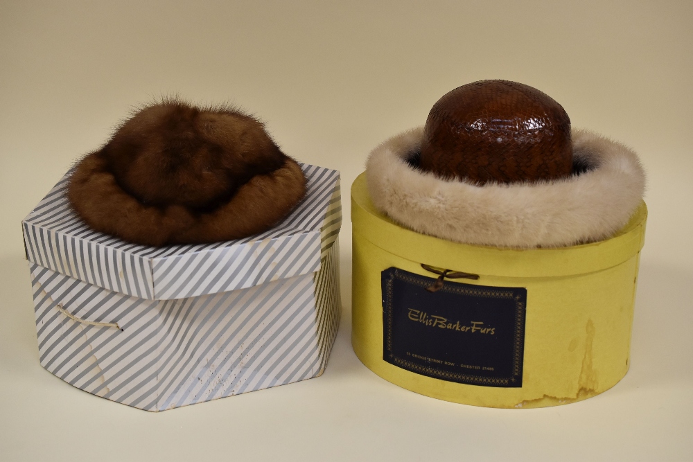 A CHRISTIAN DIOR HAT in reptile skin with fur fringe with box, together with an all fur hat and box