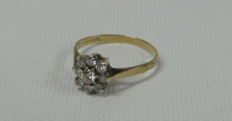 9ct GOLD STONE DIAMOND DAISY RING, 1.7gms