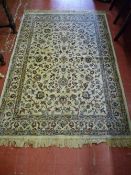 An ivory ground Cashmere rug with all over floral design and tasselled ends, 166 x 116 cms