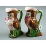 A pair of Majolica pottery owl jugs, 25 cms high (chip to base of one, 12mm chip with hairline crack